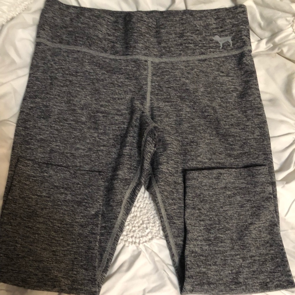 2 different pairs of capri leggings. 1 pink. 2. Idk